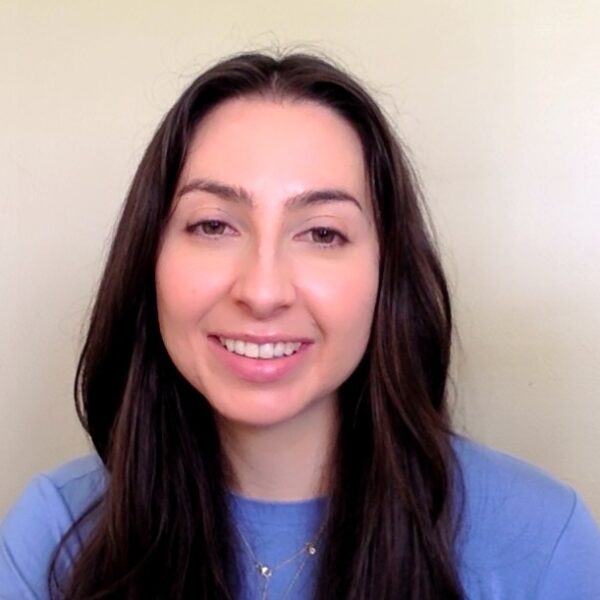 Sarah Kaplan smiling in periwinkle top