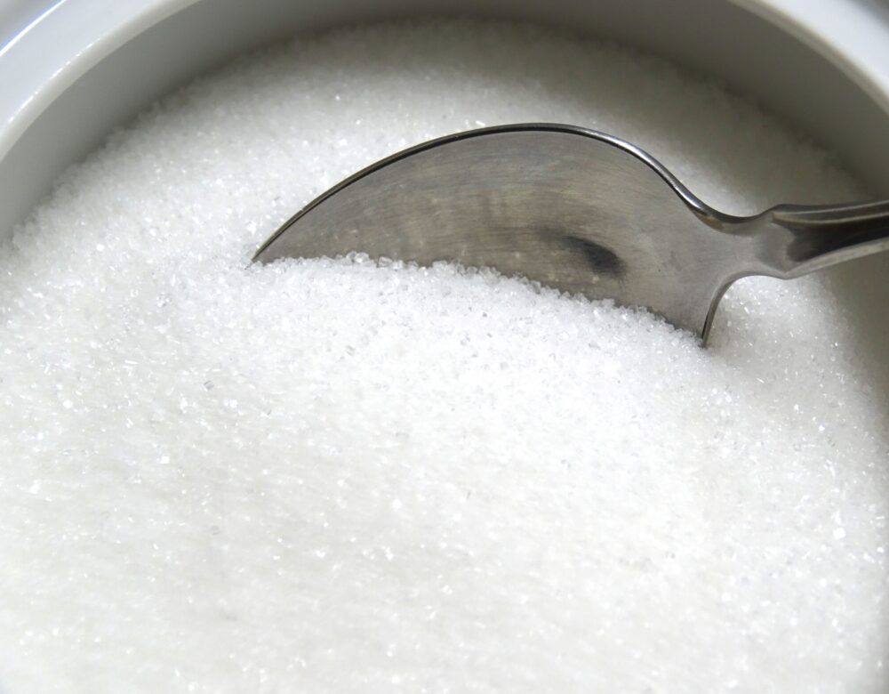 white sugar with a spoon inside
