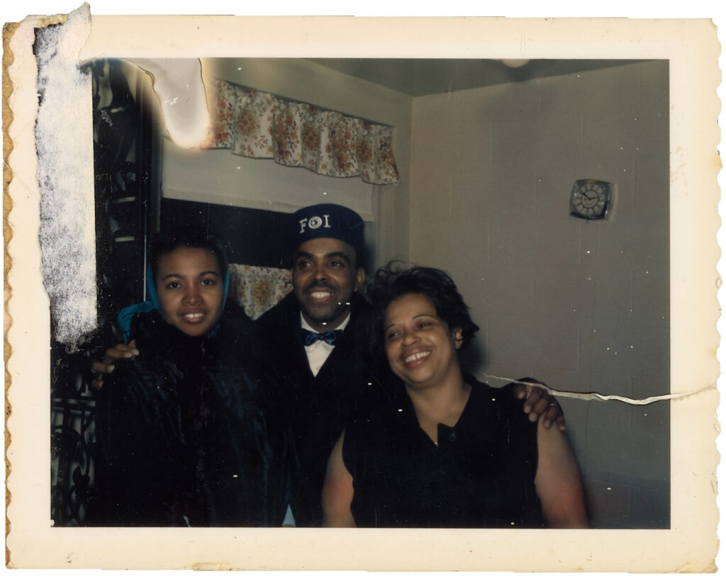 Snapshot of a two young women and a man smiling