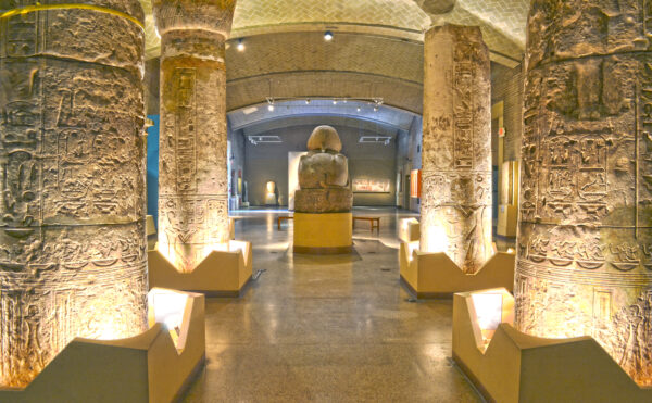 Egyptian palace at the Penn Museum, looking through columns toward the back of a statue