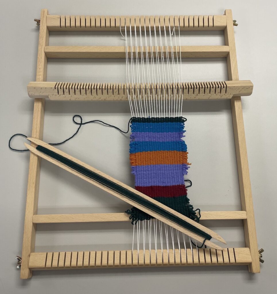 A loom with colorful yarn