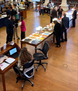 visitors in the reading room looking at book displays