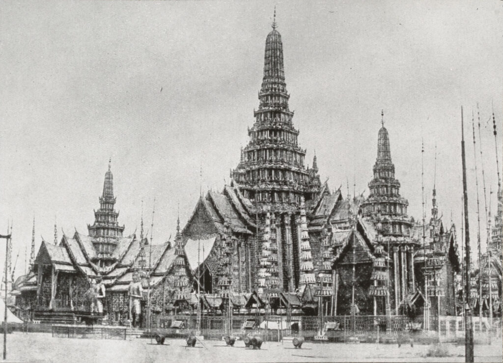 Old black and white photo of elaborate Thai buildings