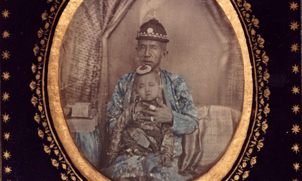 Daguerreotype of old man in royal clothing with infant child