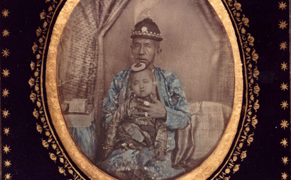 Daguerreotype of old man in royal clothing with infant child