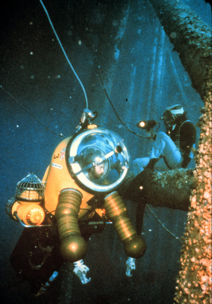 man in a diving suit underwater