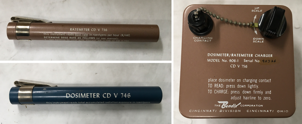 The kit’s ratemeter, (top) dosimeter (bottom), and battery-powered charger (right).