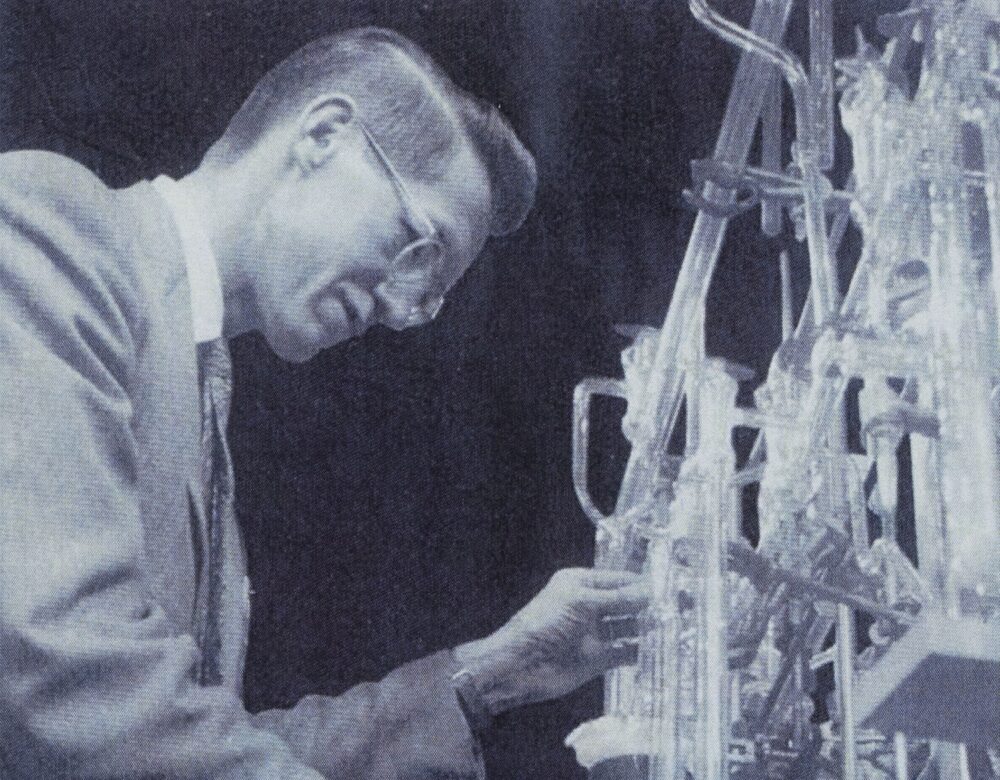 black and white photo of a man in a lab