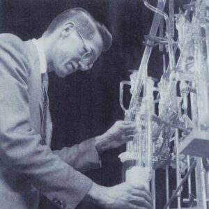 black and white photo of a man in a lab