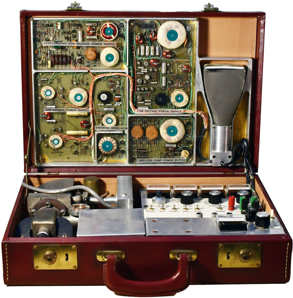 Color photo of a leather briefcase full of electronics and instruments