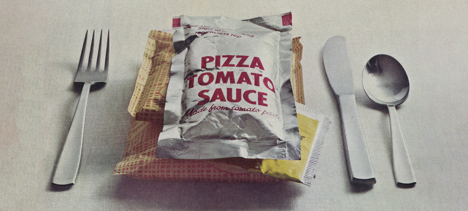 photo of prepackaged pizza with silverware