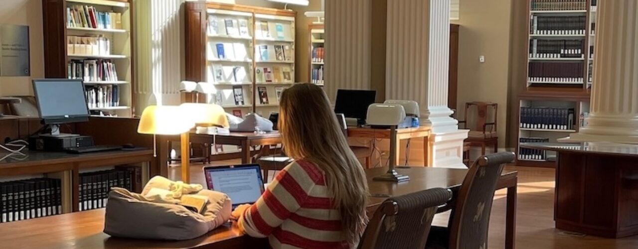 person doing research in a library