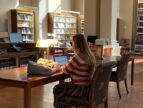 person doing research in a library