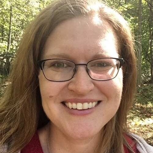 smiling woman wearing glasses