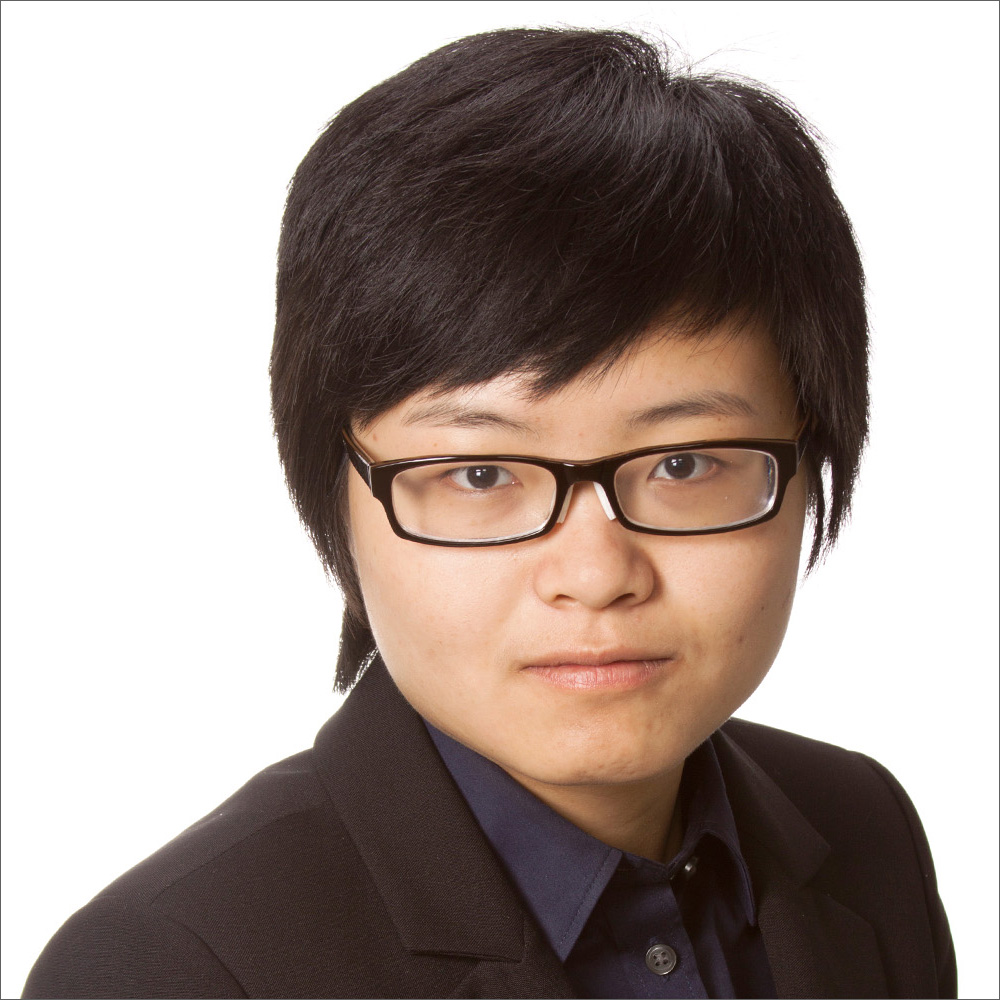 Linqian Feng, wearing glasses, dark suit, over white background