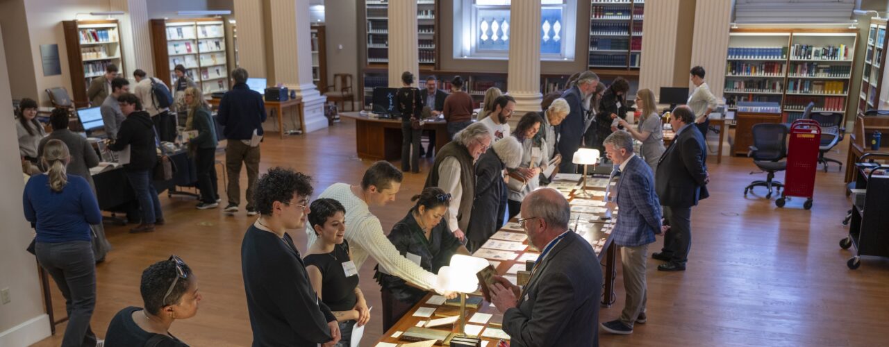people in a library looking at books