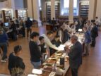 people in a library looking at books