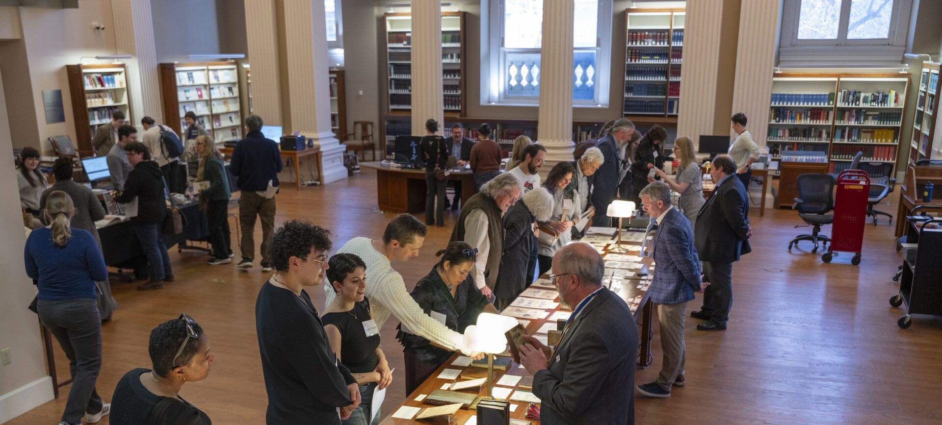 people in a library looking at books