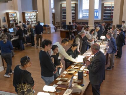 people in a library looking at books