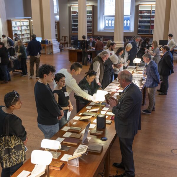people in a library looking at books