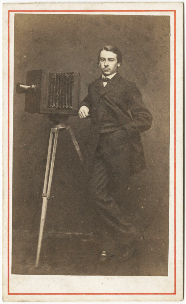 Photo portrait of a youth with a camera