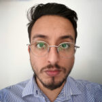 man in glasses and striped shirt