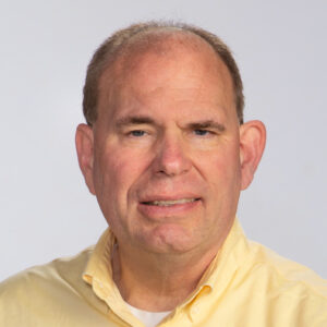 man in yellow collared shirt