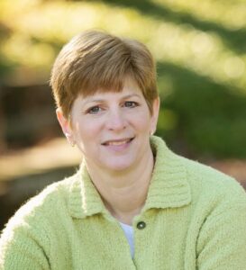 outdoor portrait of Jodi Mindell in green shirt