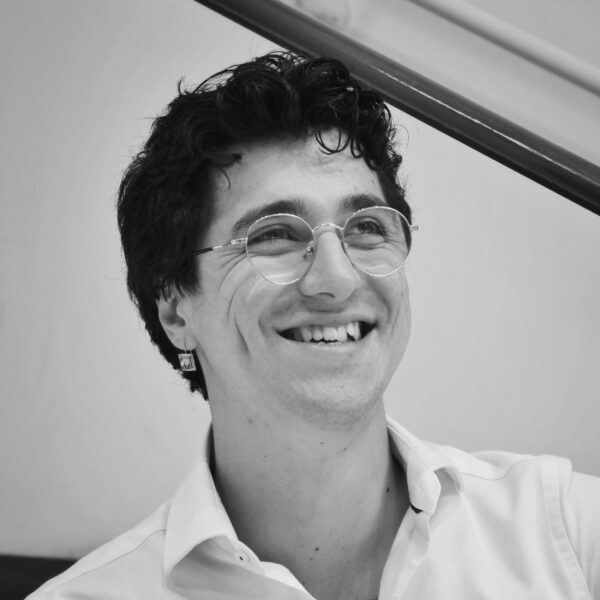 black-and-white photo of a man in glasses