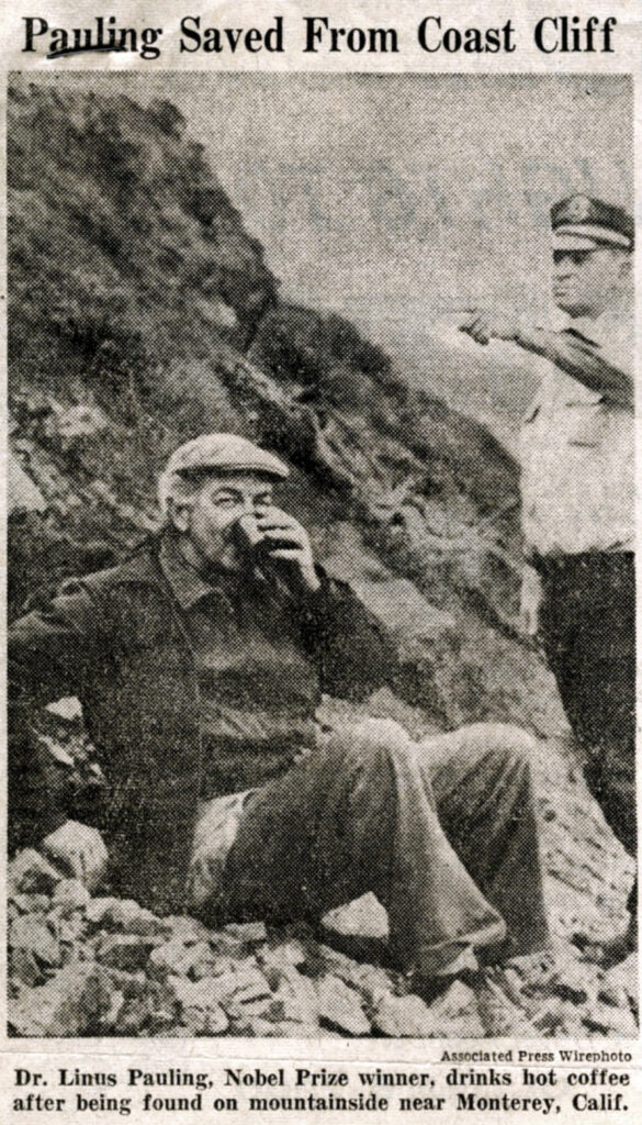 Newspaper clipping showing older man drinking from a cup at the base of a cliff while a uniformed man looks on