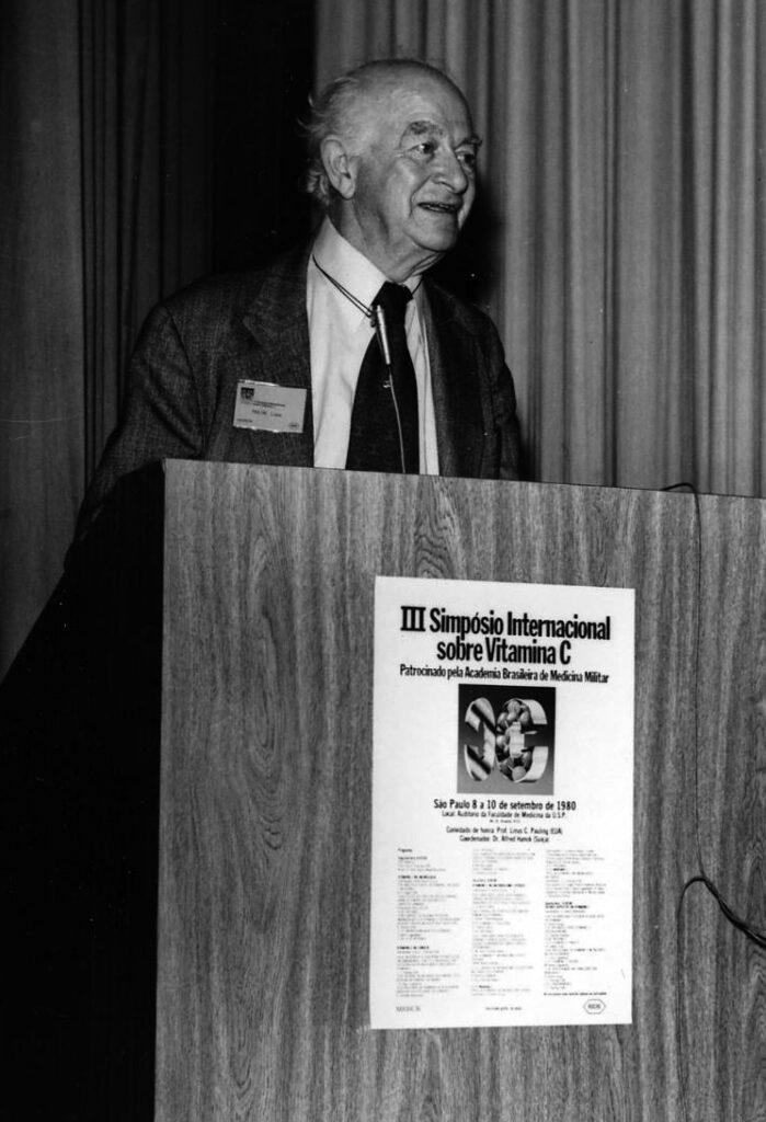 older man speaking at a lecturn