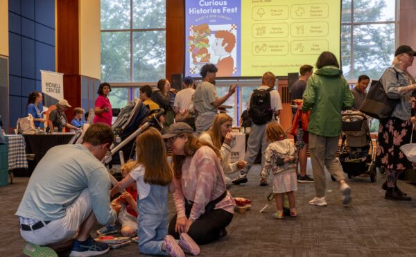 kids and parents sitting on the floor