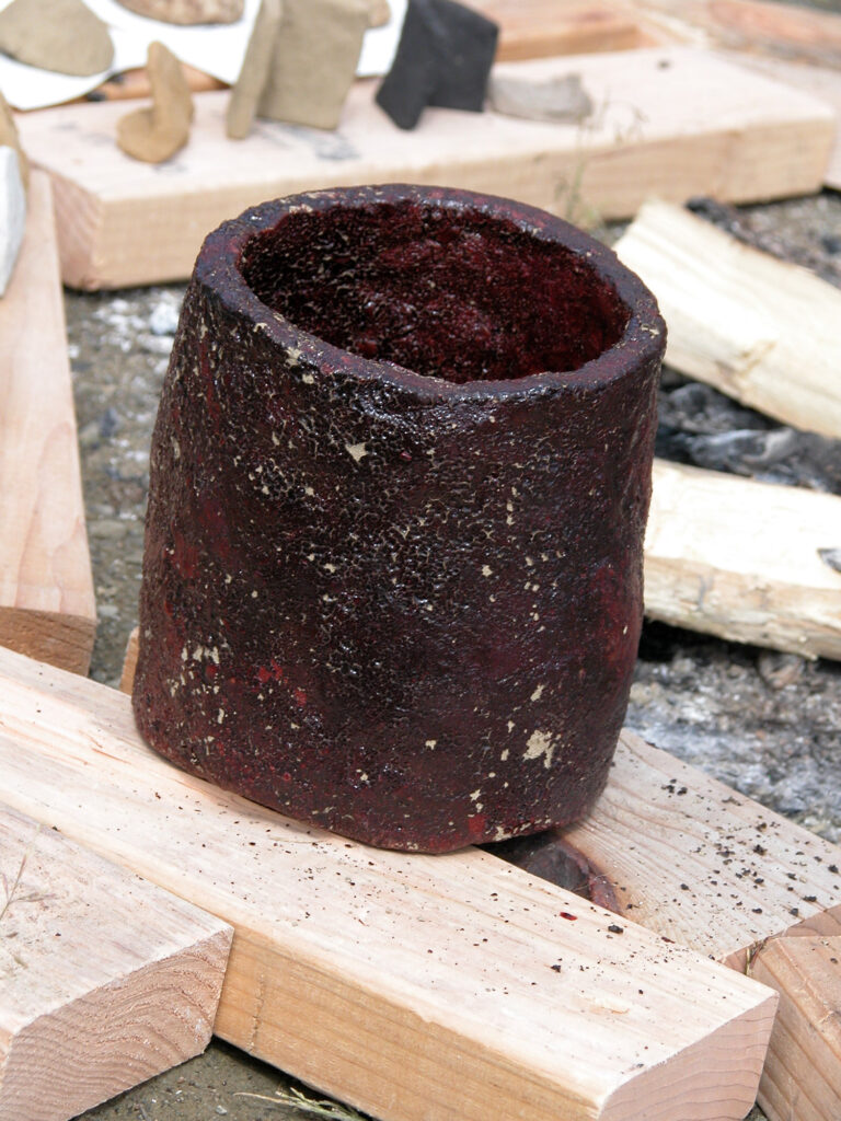 Close up a pot with a dark red hue