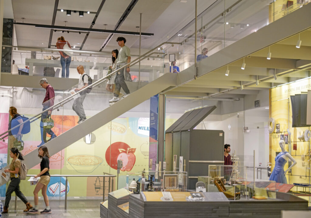 visitors descending museum stairs
