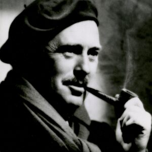 man in a hat smoking a pipe