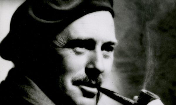 man in a hat smoking a pipe