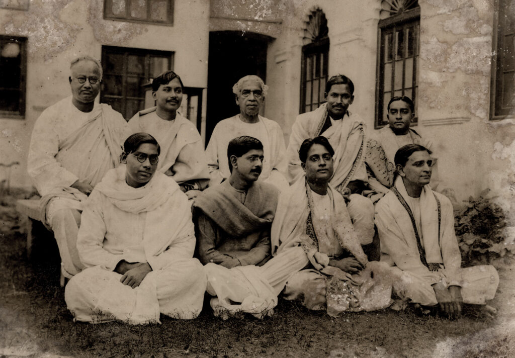 A group of men seated outdoors