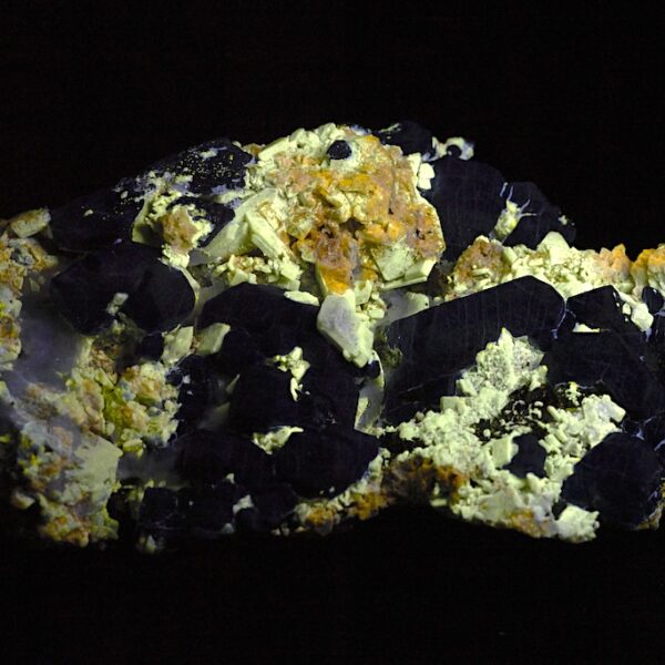 Afghanite specimen shown under ultraviolet light