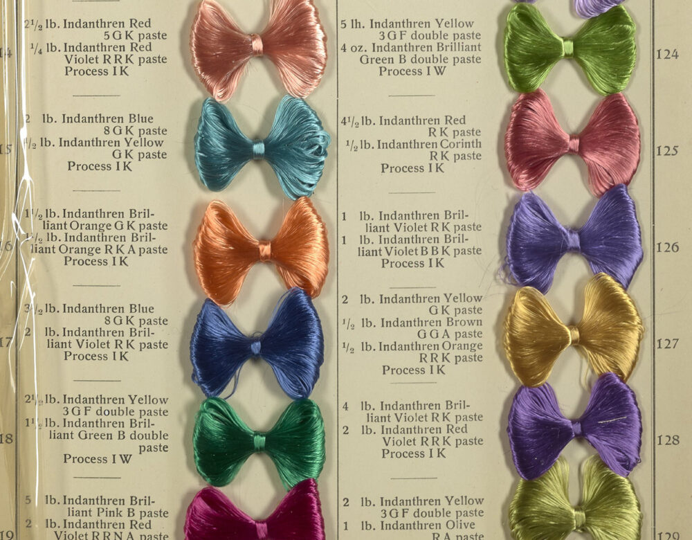 opened book of dye samples looking like bowties