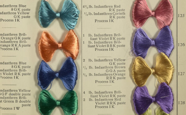 opened book of dye samples looking like bowties