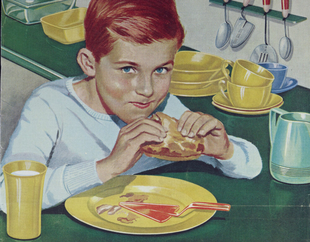magazine ad with a color illustration of a boy eating peanut butter and jelly sandwich in a kitchen