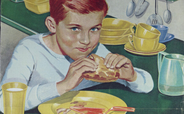 magazine ad with a color illustration of a boy eating peanut butter and jelly sandwich in a kitchen