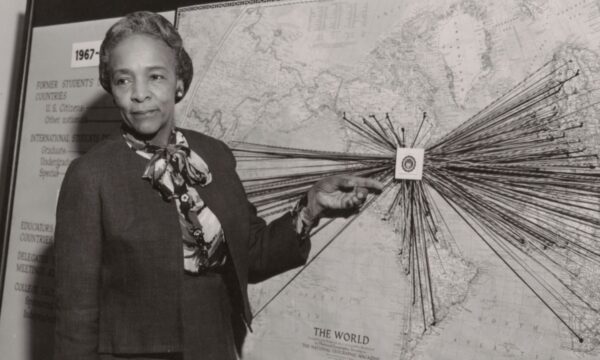 Flemmie Kittrell demonstrates something at a board.