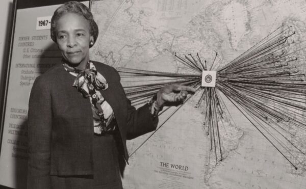 Flemmie Kittrell demonstrates something at a board.