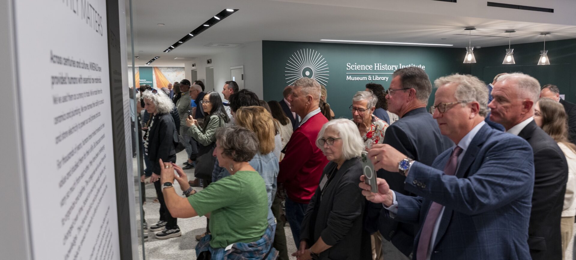 large group pf people looking at an exhibit