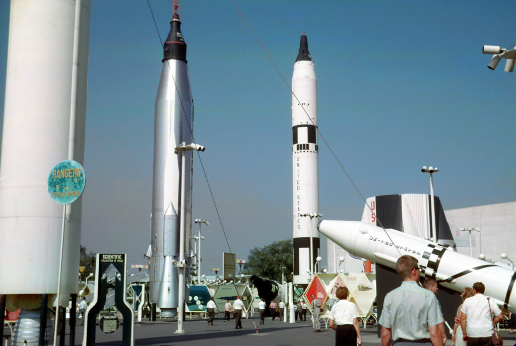 A color photo of two large rockets at an outdoor exhibition
