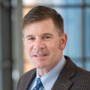 indoor portrait of a man wearing suit and tie