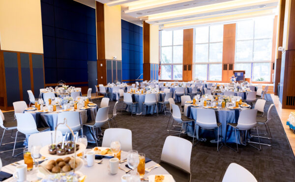 large, sunny room with tables set up for a luncheon