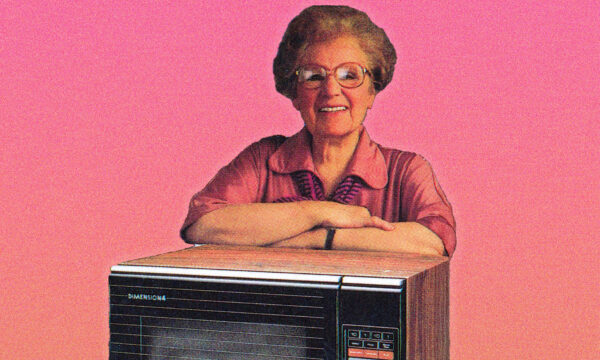 Photo of an older woman, posed on a microwave oven