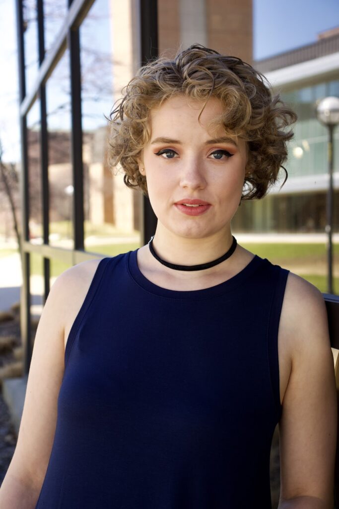 outdoor portrait of a woman in dark tank top